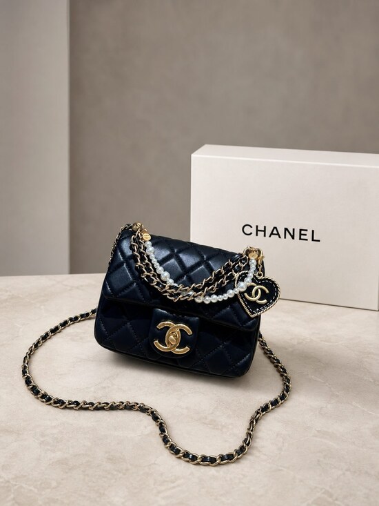 CHANEL Handbags - Chanel Mini Square Black Lambskin Pearl Chain Flap Bag